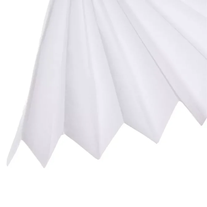 A close-up of a folded White Tissue Paper fan showcases six visible folds that form a symmetrical and geometric pattern. The tissue paper has a clean, smooth appearance with gentle shading emphasizing the folds against a plain background.