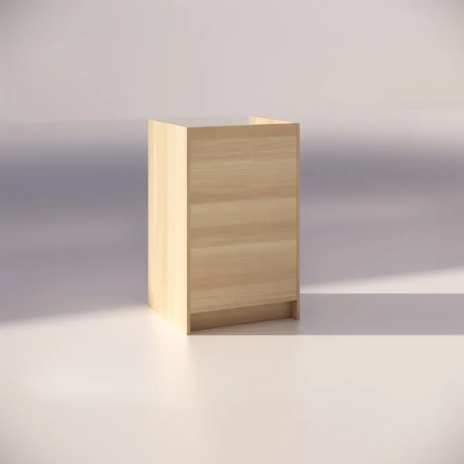 A minimalist, wooden side table with a light, natural finish is standing against a neutral background. The table has a simple, boxy shape with clean lines and no visible hardware or decorations.