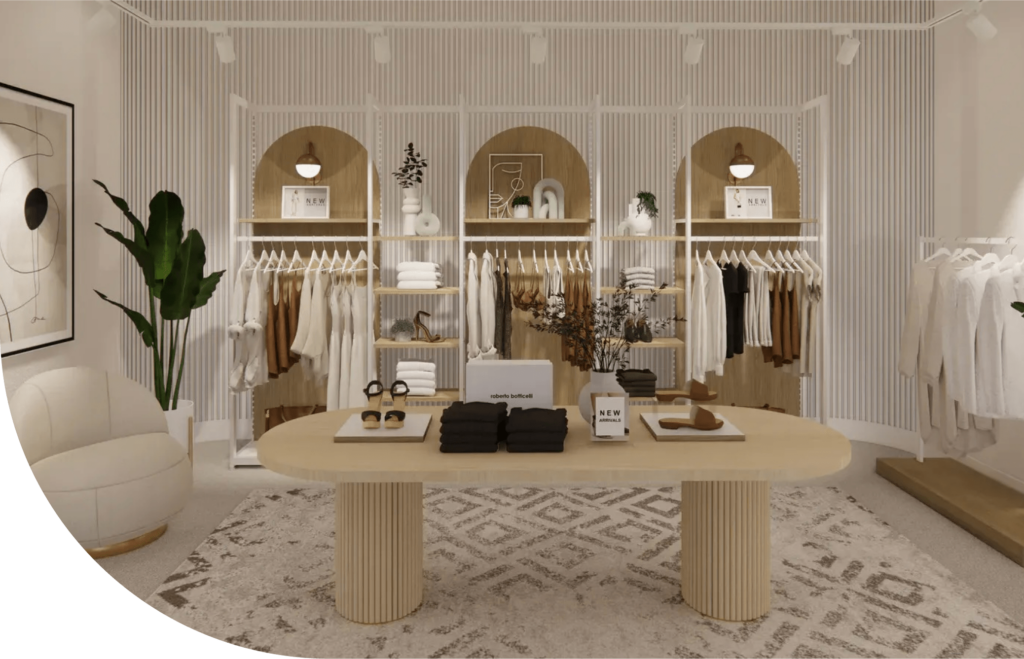 A stylish clothing store interior showcases expert shopfitting solutions, featuring a wooden table with folded clothes and accessories. White shelves with neatly arranged garments and decorative items stand in the background. Soft lighting and a patterned rug enhance the elegant ambiance.